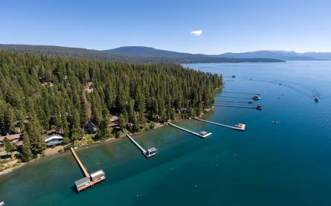 Aerial photo of lakefront homes and piers on Lake Tahoe
